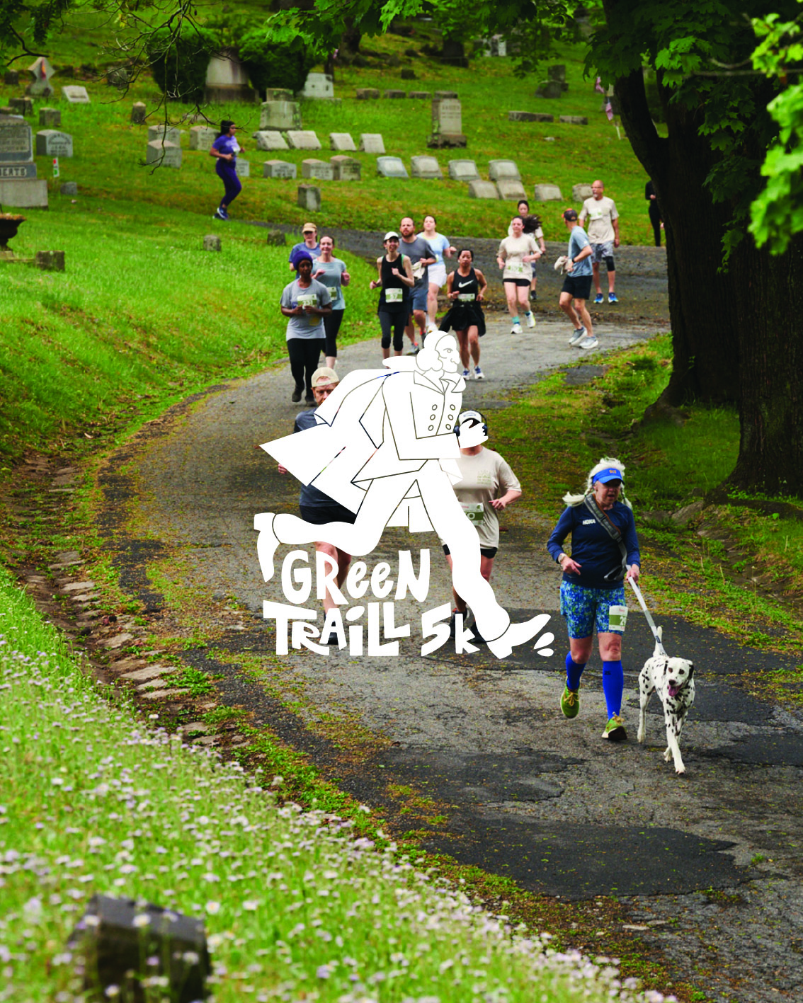 photo from green traill race - line of runners on path in cemetery