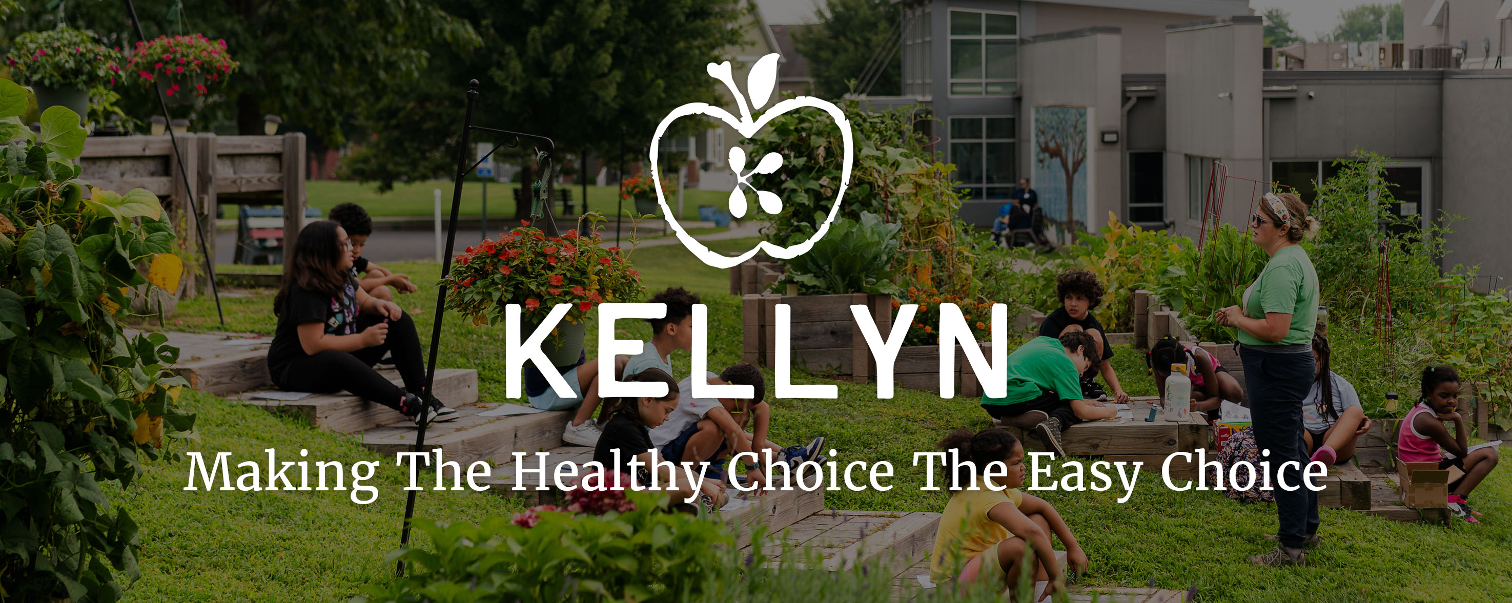 Kellyn logo - an apple with four different seeds in the shape of k in the middle - on top of an image of a kellyn program
