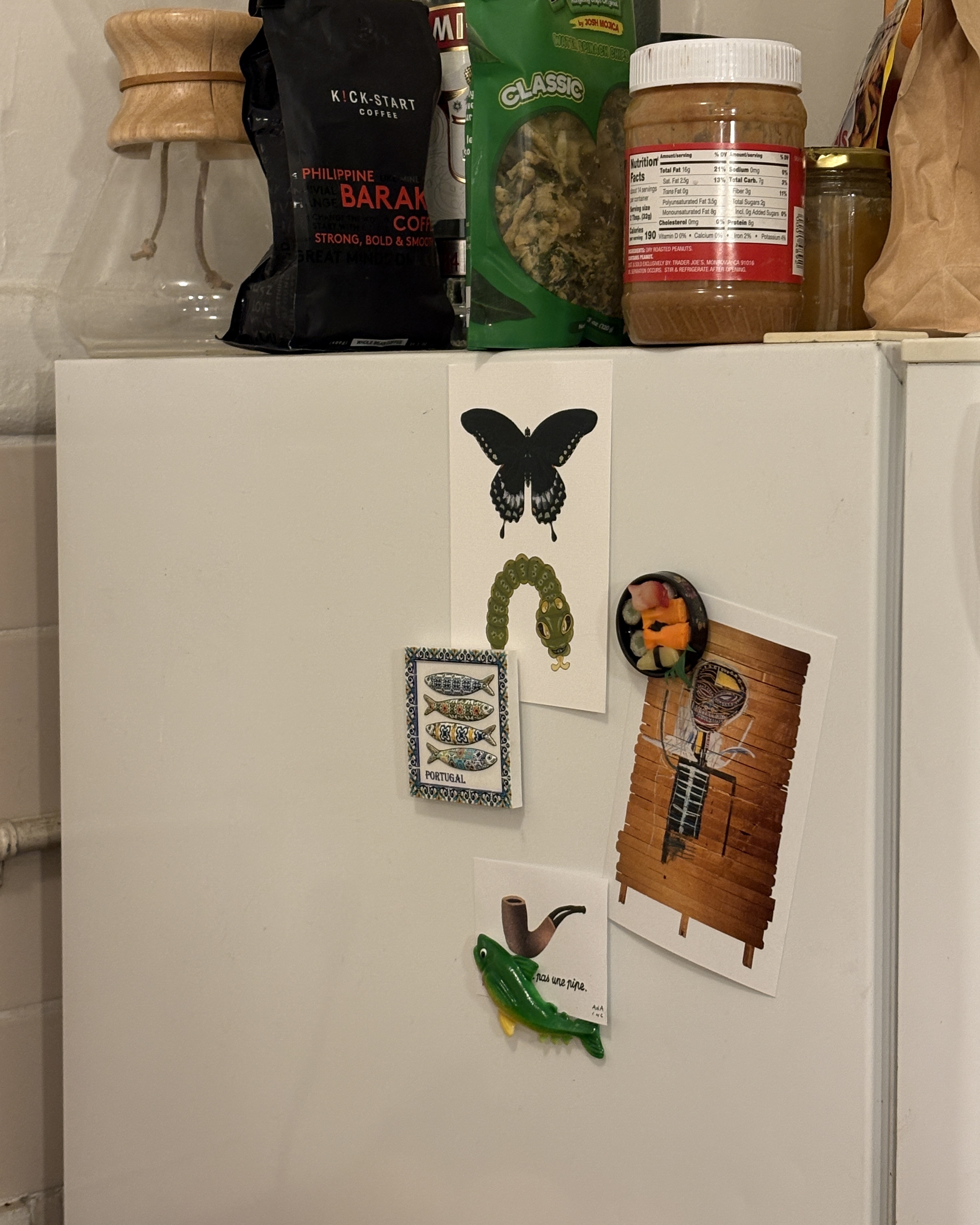 print club among other prints and items on a wall